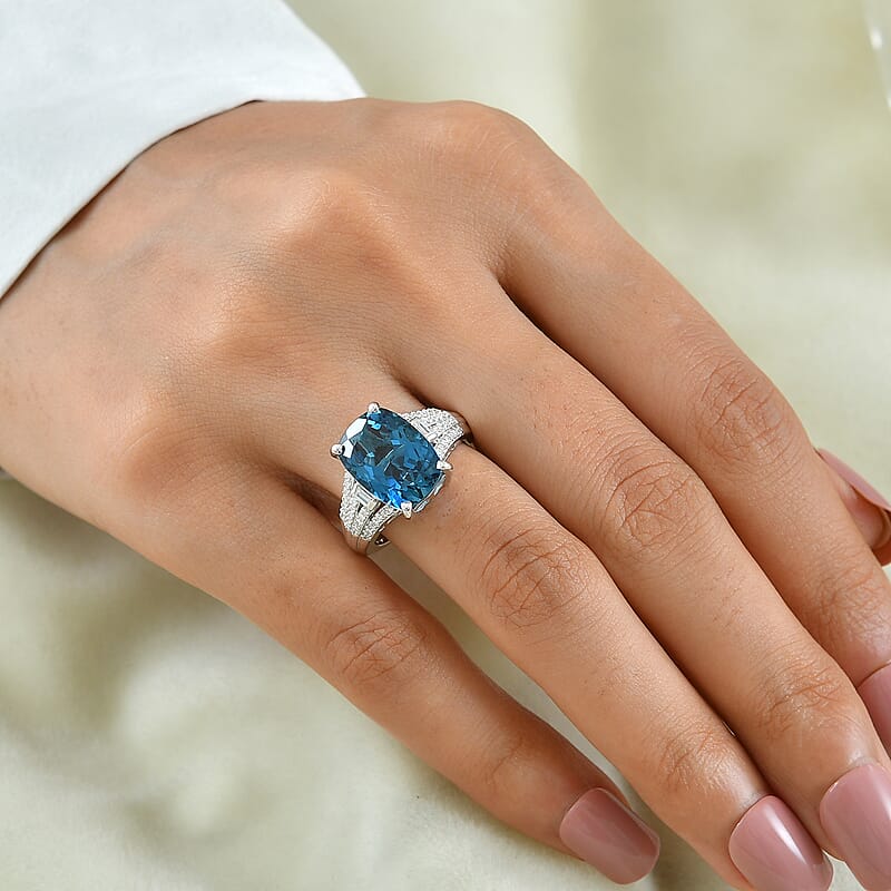 D'Joy London Blue Topaz and Moissanite 7.80 ctw Ocean Citadel Ring in Rhodium Over Sterling Silver (Size 6.0)
