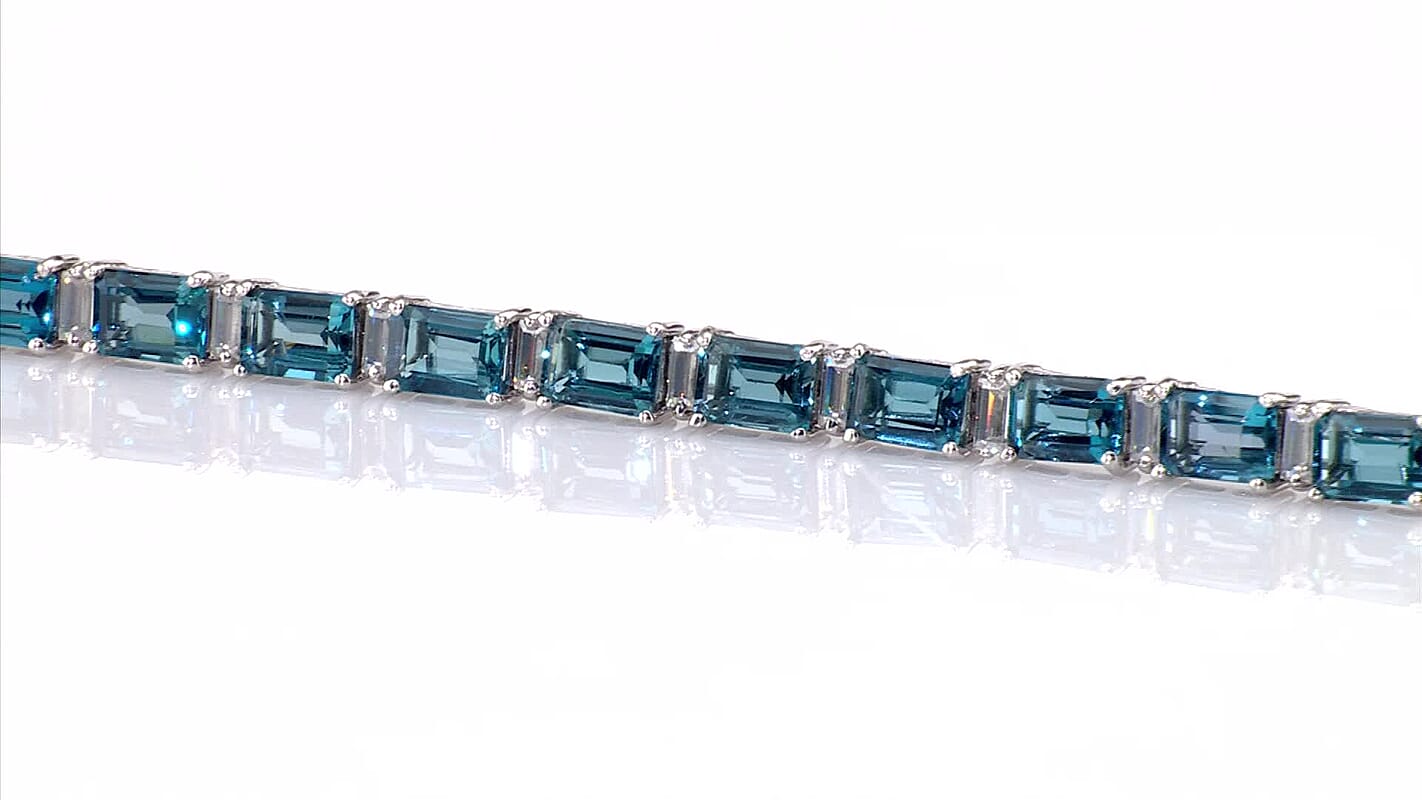D''Joy London Blue Topaz and Moissanite 26.70 ctw Bracelet in Rhodium Over Sterling Silver (7.25 In)