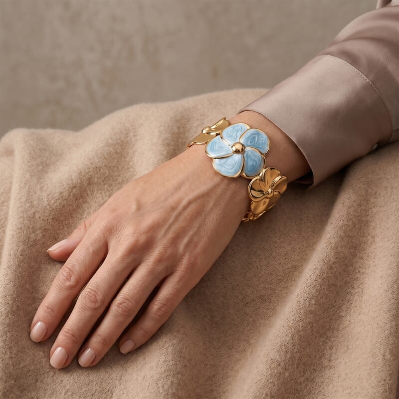 Fashionable Blue Enameled Flower Cuff Bracelet in ION Plated YG Stainless Steel (6.5-7.5In)