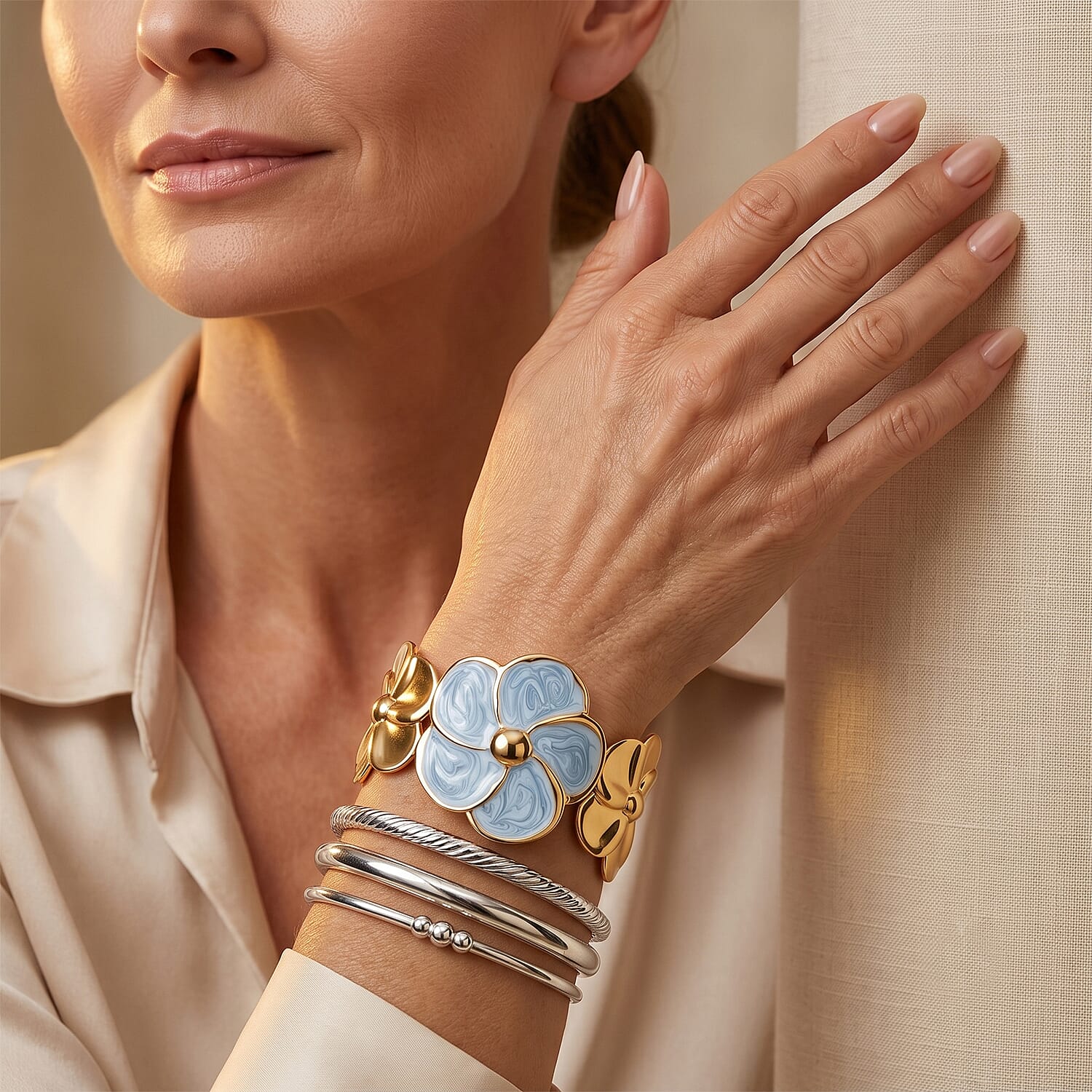 Fashionable Blue Enameled Flower Cuff Bracelet in ION Plated YG Stainless Steel (6.5-7.5In)