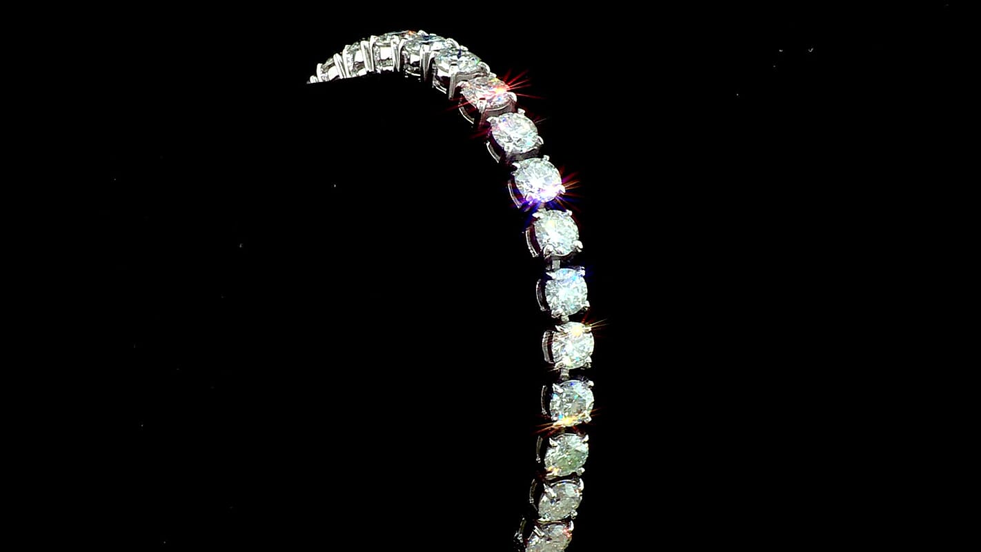 D'Joy Certified Moissanite (Rnd 5mm) (D, VS) Tennis Bracelet in Rhodium Over Sterling Silver (6.50 In) (Ships in 5-7 Days) 14.25 ctw