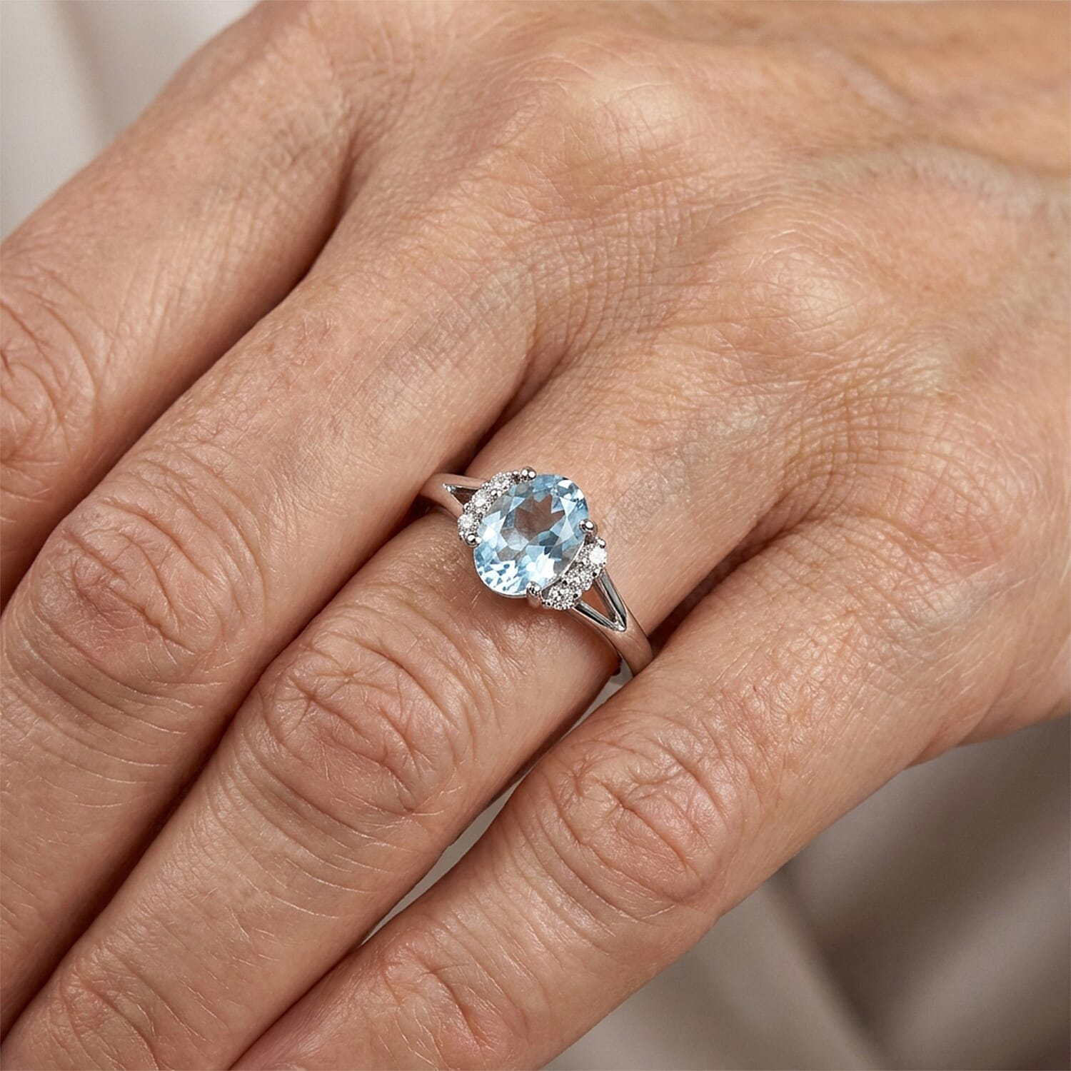 Blue Topaz and Simulated Diamond 0.92 ctw Ring in Sterling Silver (Size 7.0)