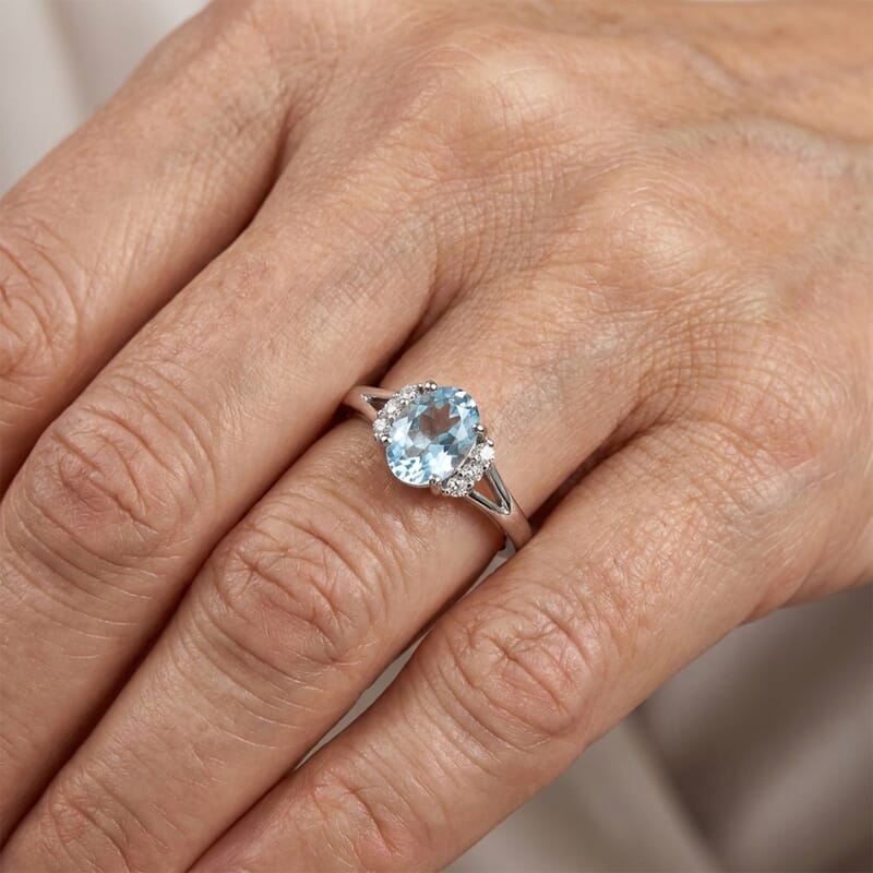 Blue Topaz and Simulated Diamond 0.92 ctw Ring in Sterling Silver (Size 7.0)