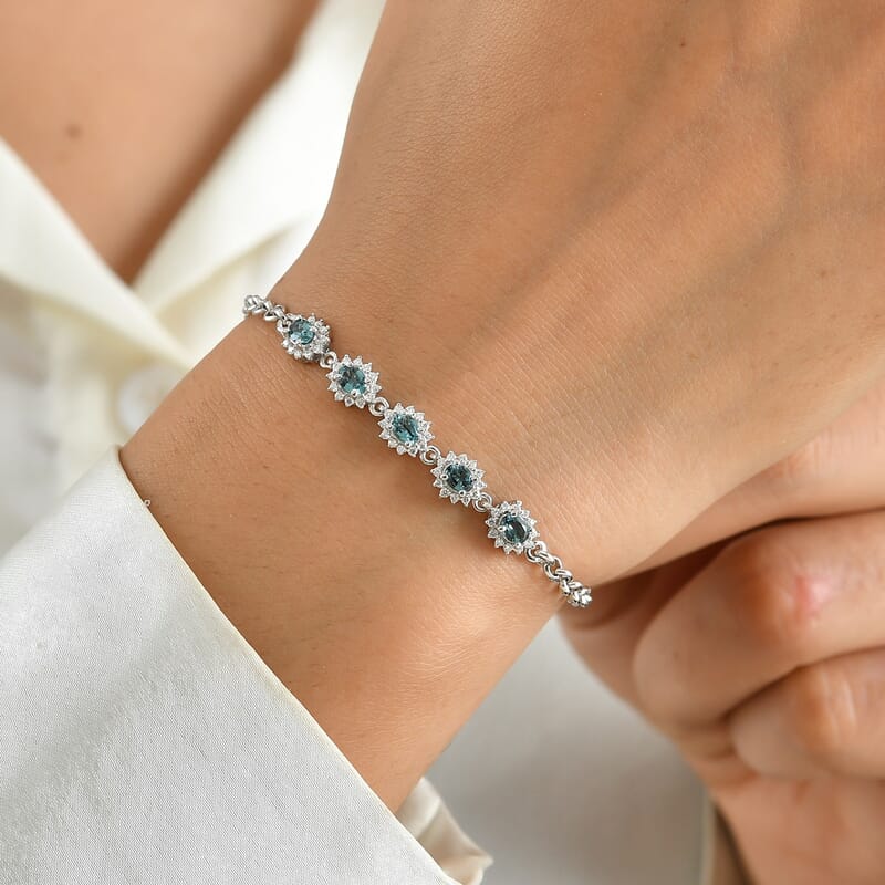 D'Joy AAA Monte Belo Indicolite and Moissanite 1.35 ctw Regal Bloom Line Bracelet in Rhodium Over Sterling Silver (7.25 In)