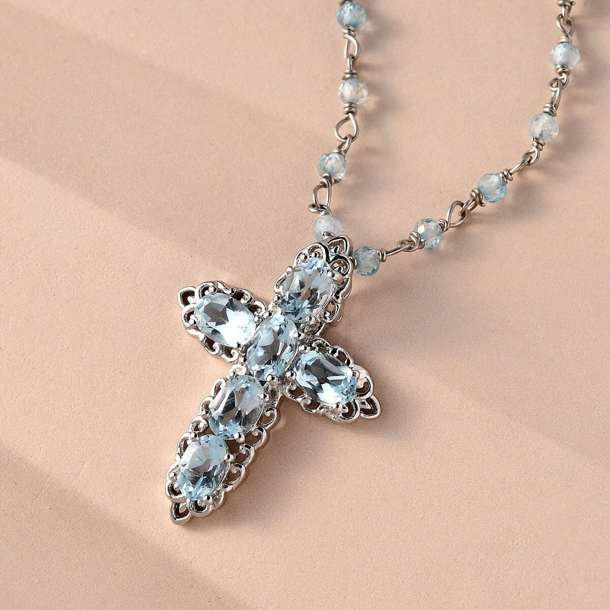 Karis Sky Blue Topaz Cross Pendant Necklace 20 Inches in Platinum Bond 17.80 ctw image number 1