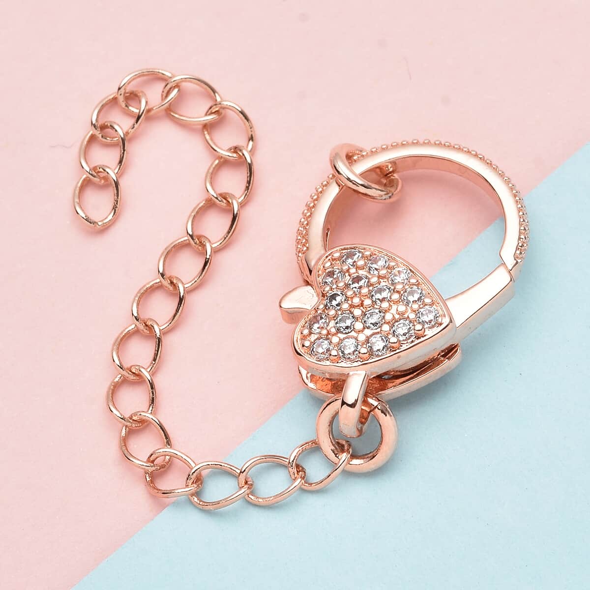 Simulated Diamond Solder Ring, Extension Chain 2 Inches with Heart Shape Lobster Lock in Rosetone 0.30 ctw image number 1
