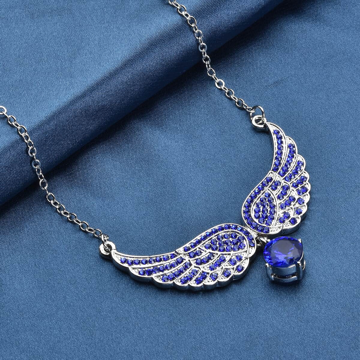 Simulated Blue Sapphire and Tanzanite Blue Color Austrian Crystal Angel Wings Necklace 20.5-22.5 Inches in Silvertone 1.50 ctw image number 1