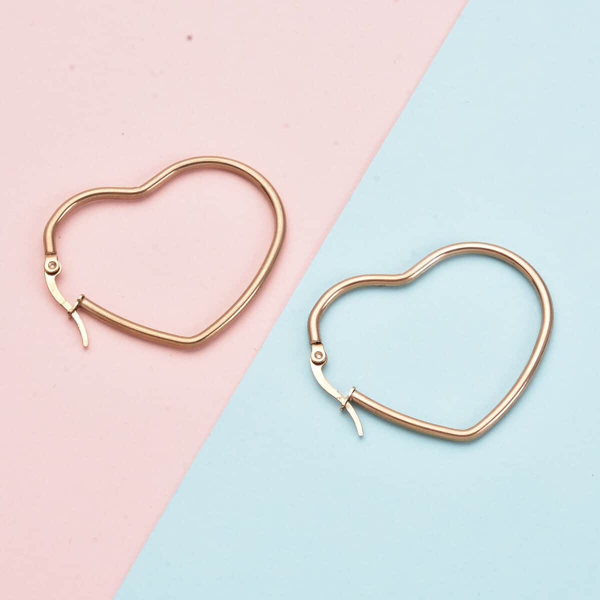 Heart Shaped Hoop Earrings in ION Plated Rose Gold Stainless Steel image number 1
