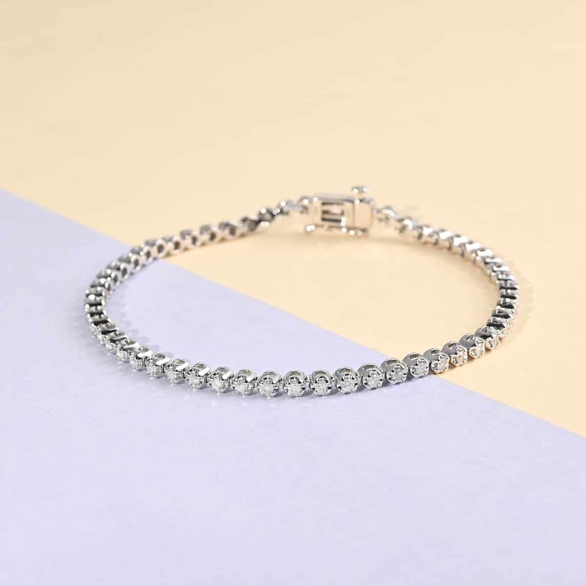 NY Closeout 10K White Gold G-H I3 Diamond Tennis Bracelet (7.00 In) 7.90 Grams 1.00 ctw image number 1
