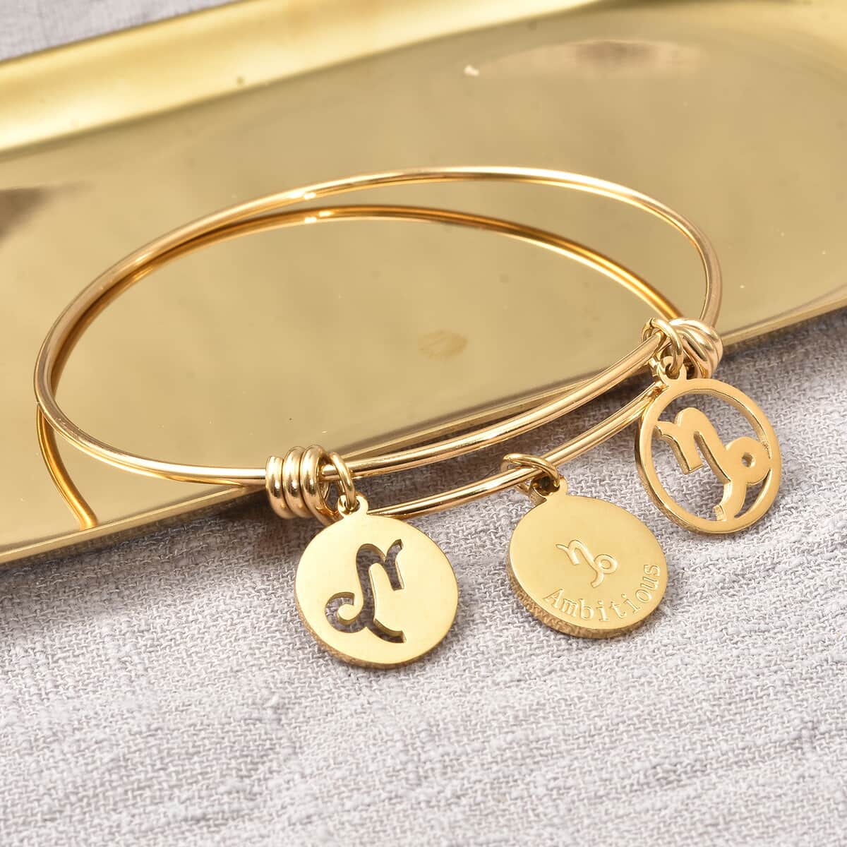 Capricorn Zodiac Bangle Bracelet Gift Set in ION Plated Yellow Gold Stainless Steel (6-9 in) image number 2