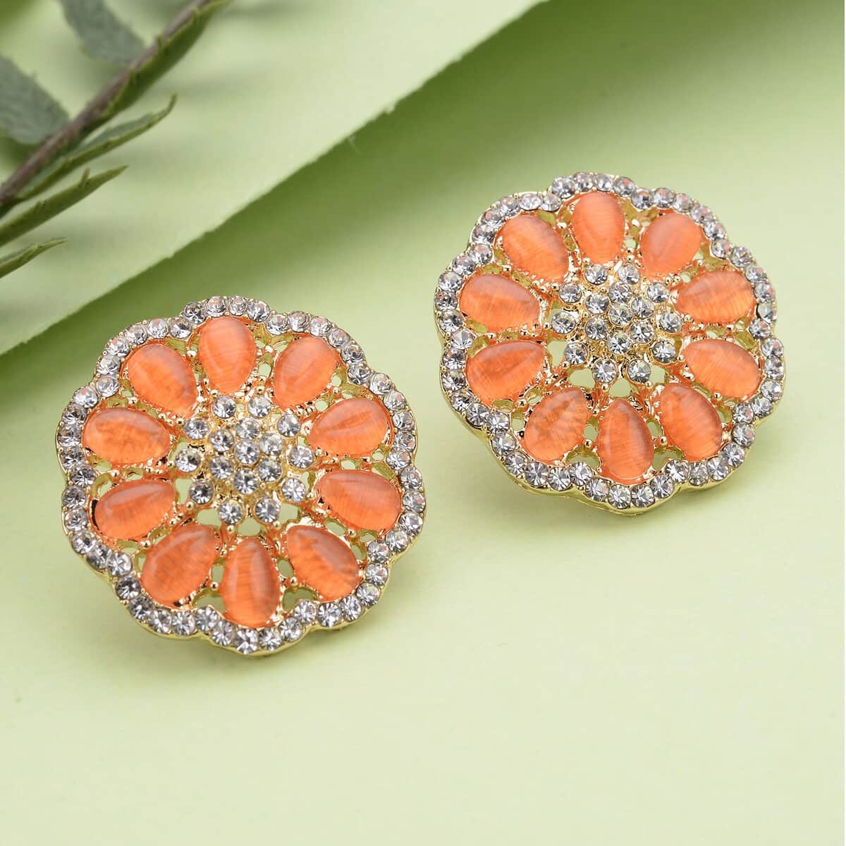 Simulated Orange Cat's Eye and Austrian Crystal Floral Stud Earrings in Goldtone 5.00 ctw image number 1