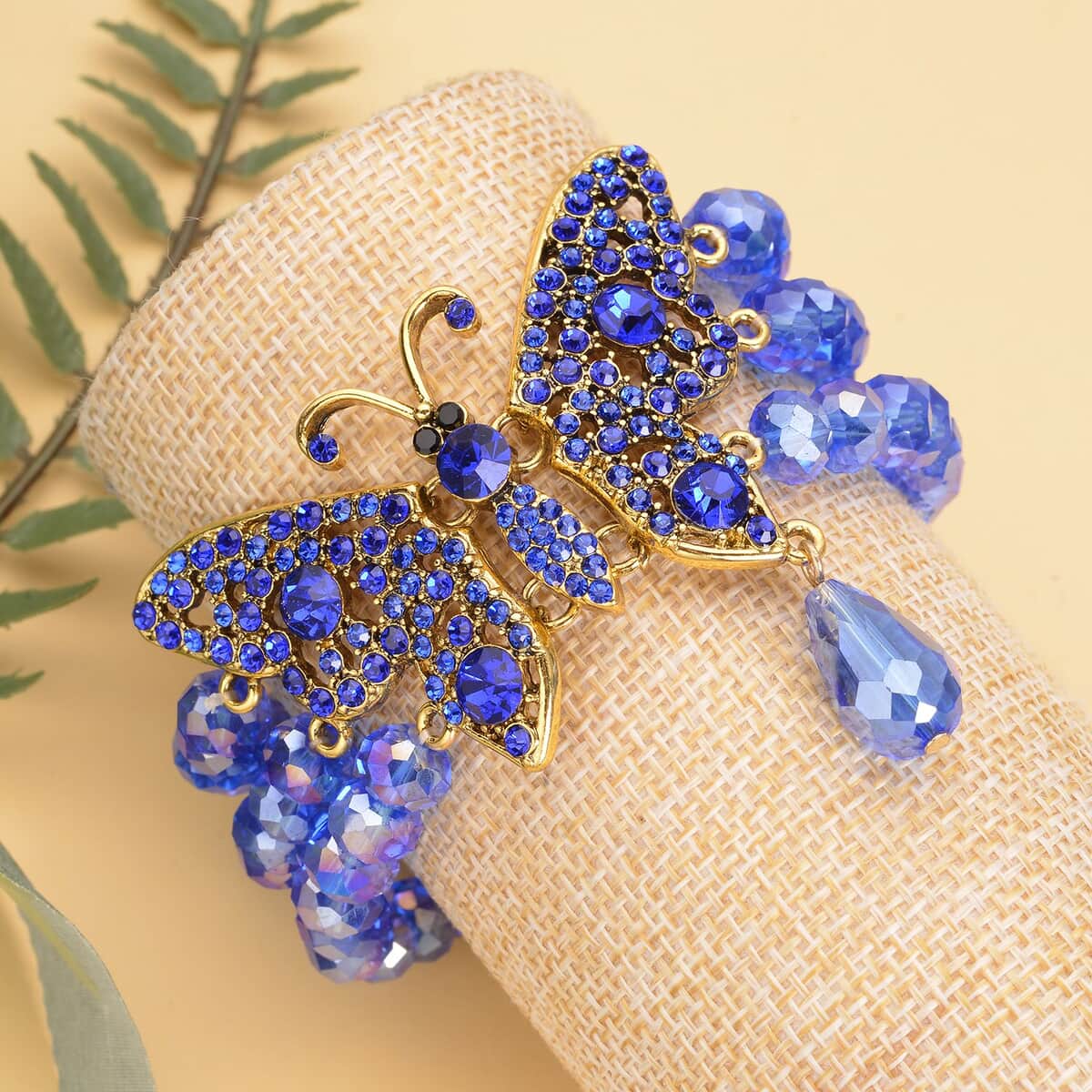 Blue Glass, Black and Blue Austrian Crystal Beaded Layered Butterfly Bracelet in Goldtone (7.50 In) image number 1