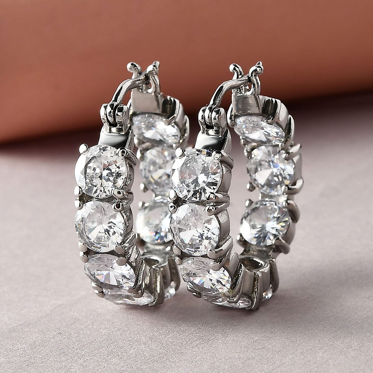 Simulated White Diamond Hoop Earrings in Stainless Steel 21.10 ctw image number 1