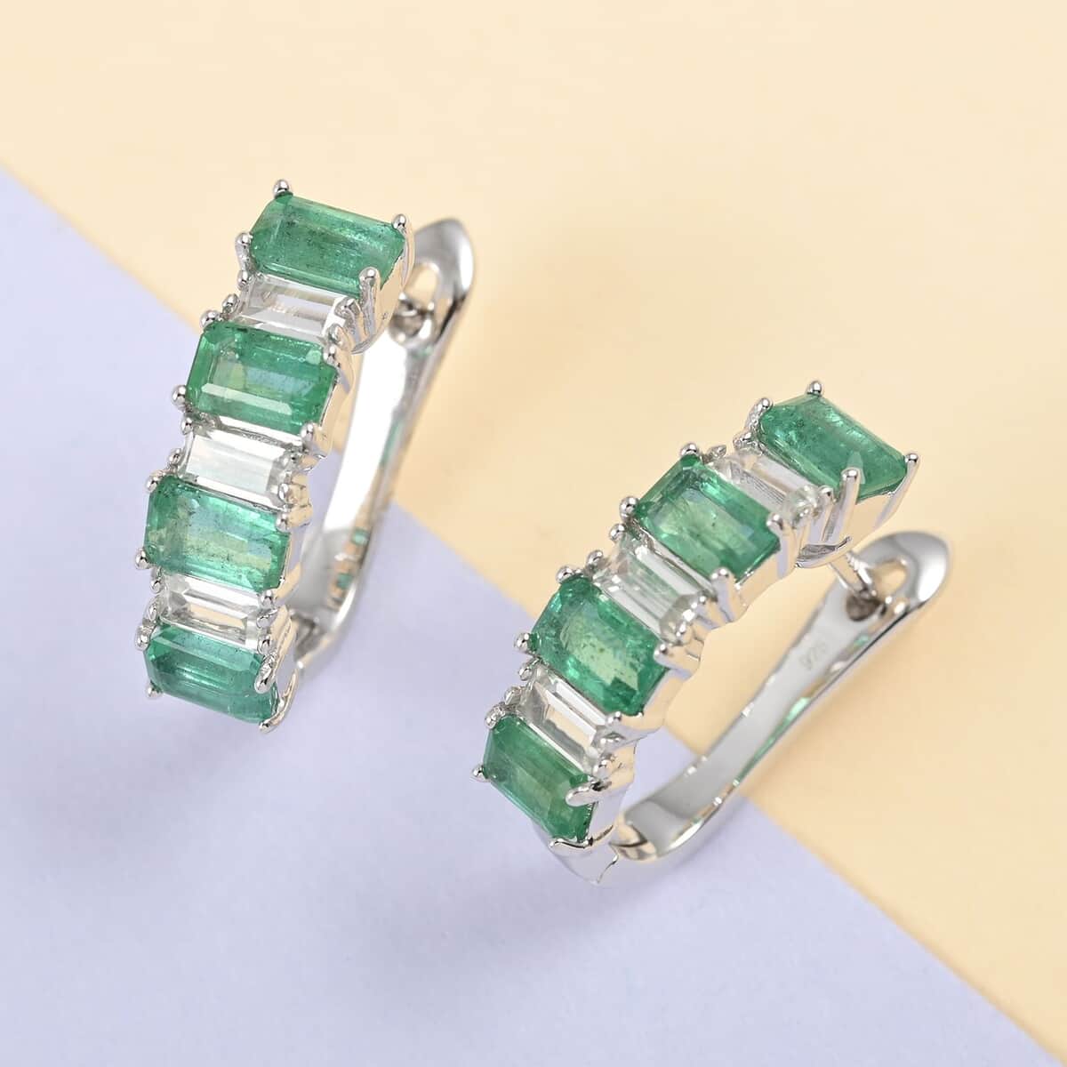 AAA Kagem Emerald and Natural White Zircon Huggie Hoop Earrings in Rhodium Over Sterling Silver 3.15 ctw image number 1