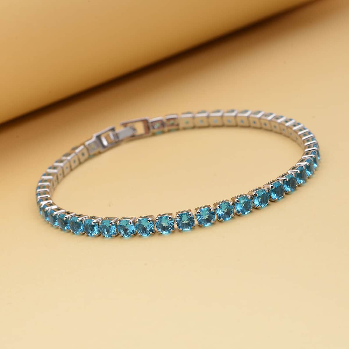 Simulated Blue Topaz Tennis Bracelet in Silvertone (8.00 In) 13.00 ctw image number 1
